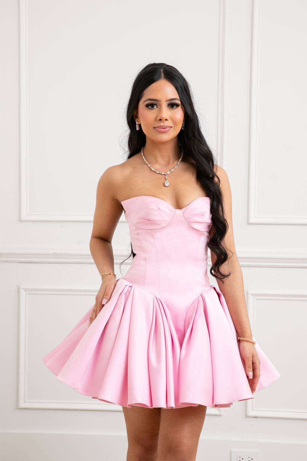 The Palais Dress by Brunell by Shar, front view of luxury pink strapless satin mini dress with winged bust cups, fitted bodice and full volume skirt.