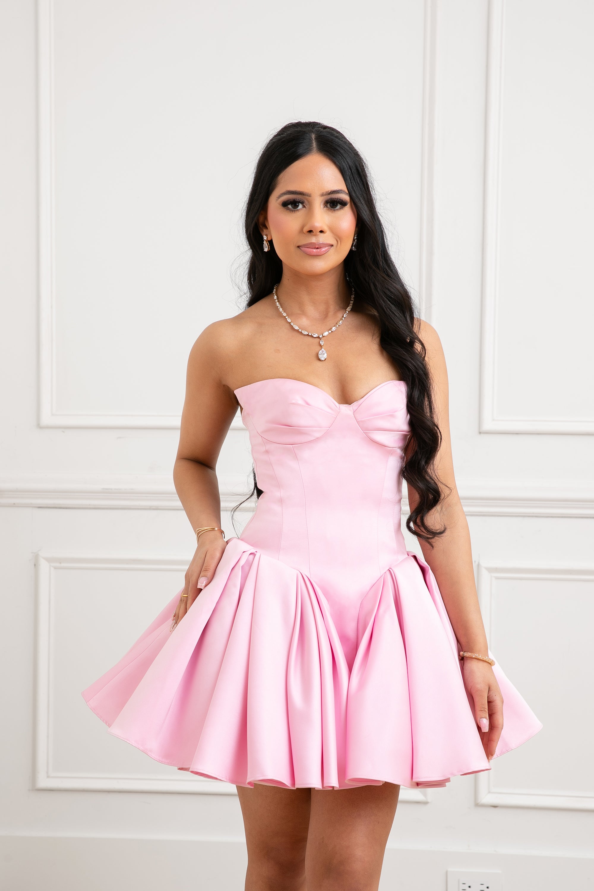 The Palais Dress by Brunell by Shar, front view of luxury pink strapless satin mini dress with winged bust cups, fitted bodice and full volume skirt.